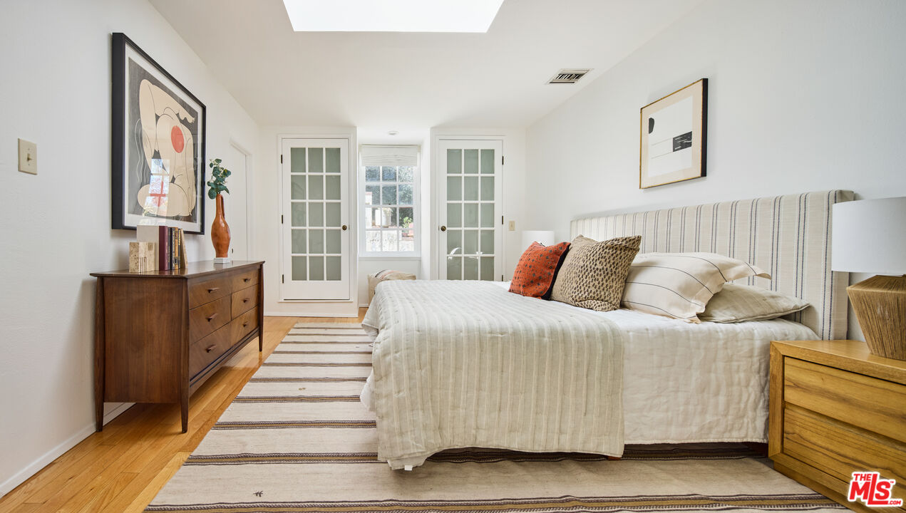 6948 St Estaban Street Tujunga, CA 91042 - Photo 8 of 26 a bed room with a bed and a couch