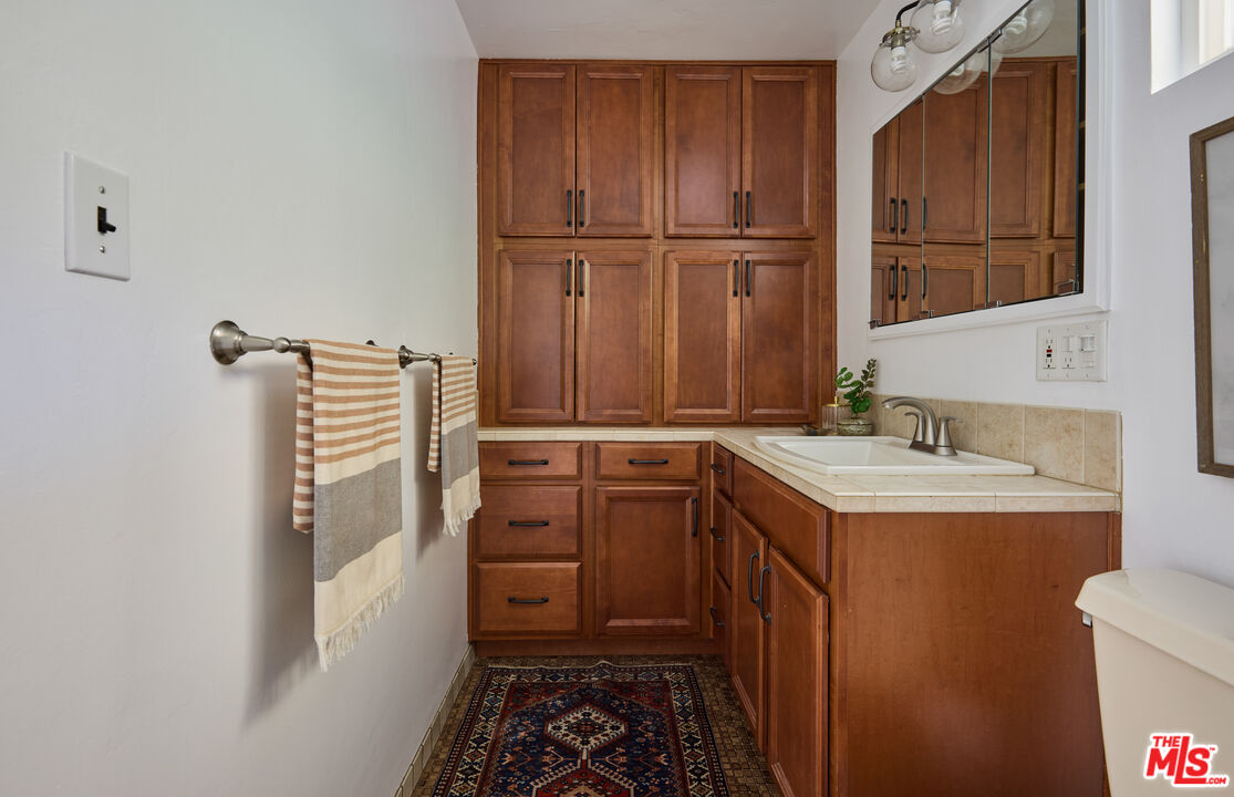 6948 St Estaban Street Tujunga, CA 91042 - Photo 9 of 26 a kitchen with a sink and a refrigerator