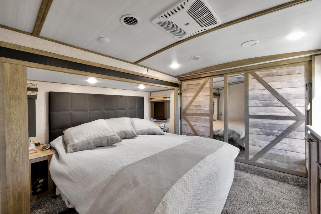 69411 Ramon Road, Unit 502 Cathedral City, CA 92234 - Photo 20 of 23 a bedroom with a large bed and a large window