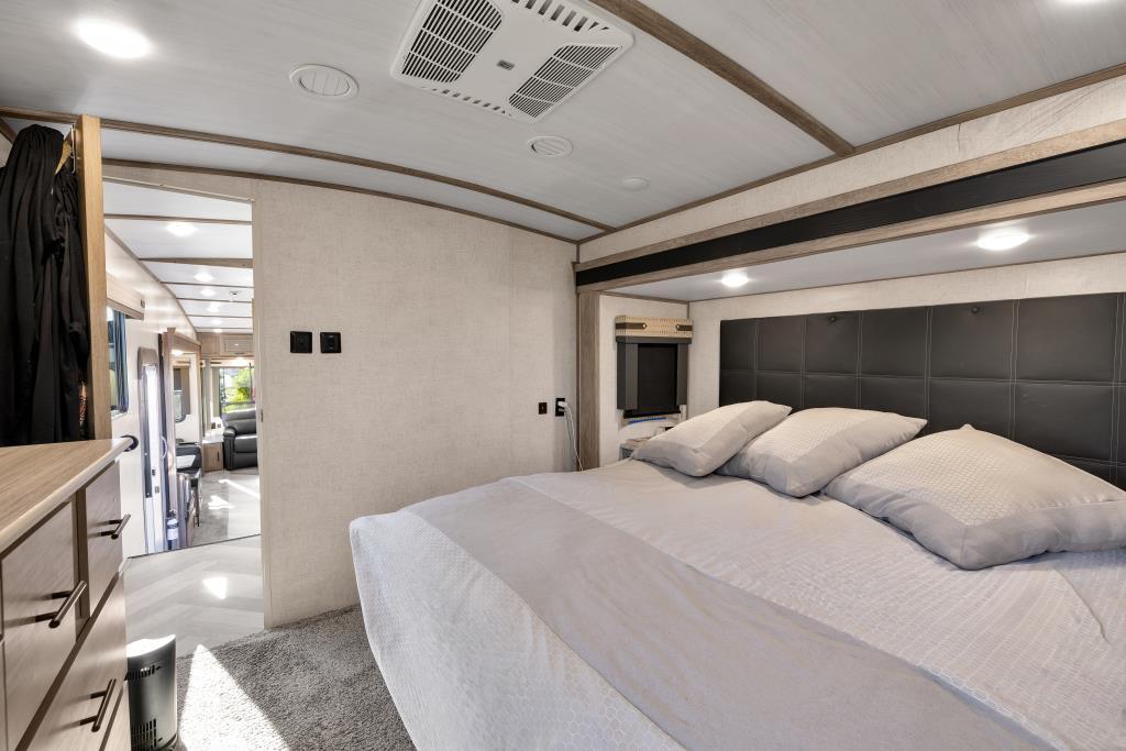 69411 Ramon Road, Unit 502 Cathedral City, CA 92234 - Photo 21 of 23 a bedroom with a large bed and a large window