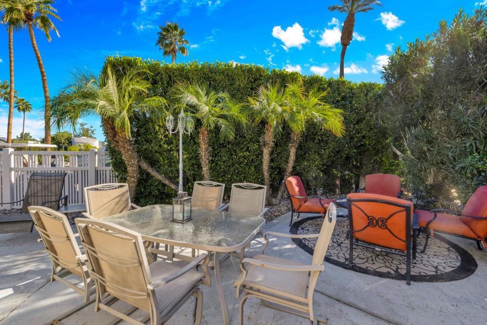 69411 Ramon Road, Unit 502 Cathedral City, CA 92234 - Photo 8 of 23 a view of an chairs and tables in the patio