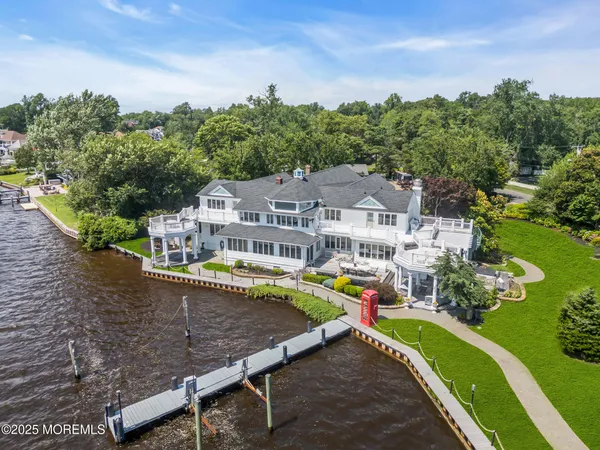 an aerial view of a house with a big yard