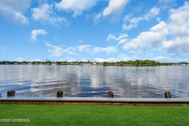 a front view of a house with a garden and plants