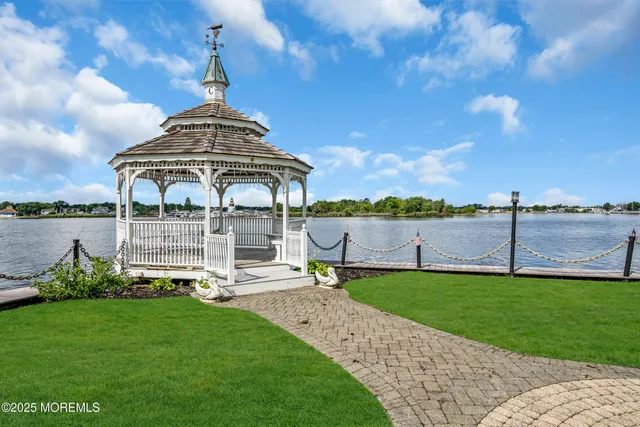 a bathroom with a toilet a sink and a mirror