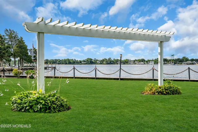 a bedroom with furniture and a large window