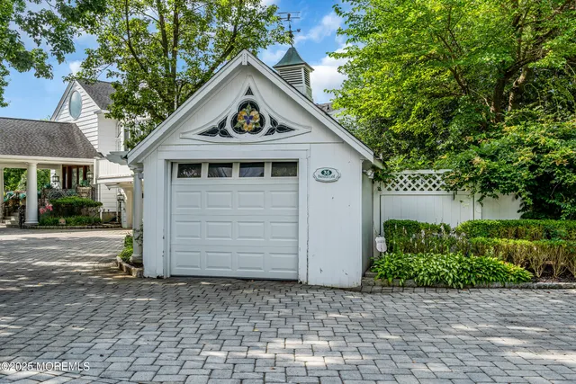 a view of a patio with table and chairs with wooden floor and fence