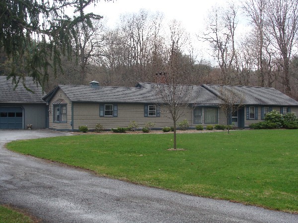 3 Cherry Hill Road Stockbridge, MA 01262 - Photo 1 of 17 a front view of a house with a garden