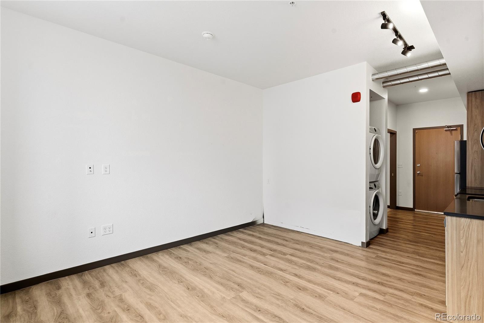603 Inca Street, Unit 330 Denver, CO 80204 - Photo 12 of 18 a view of a room with wooden floor