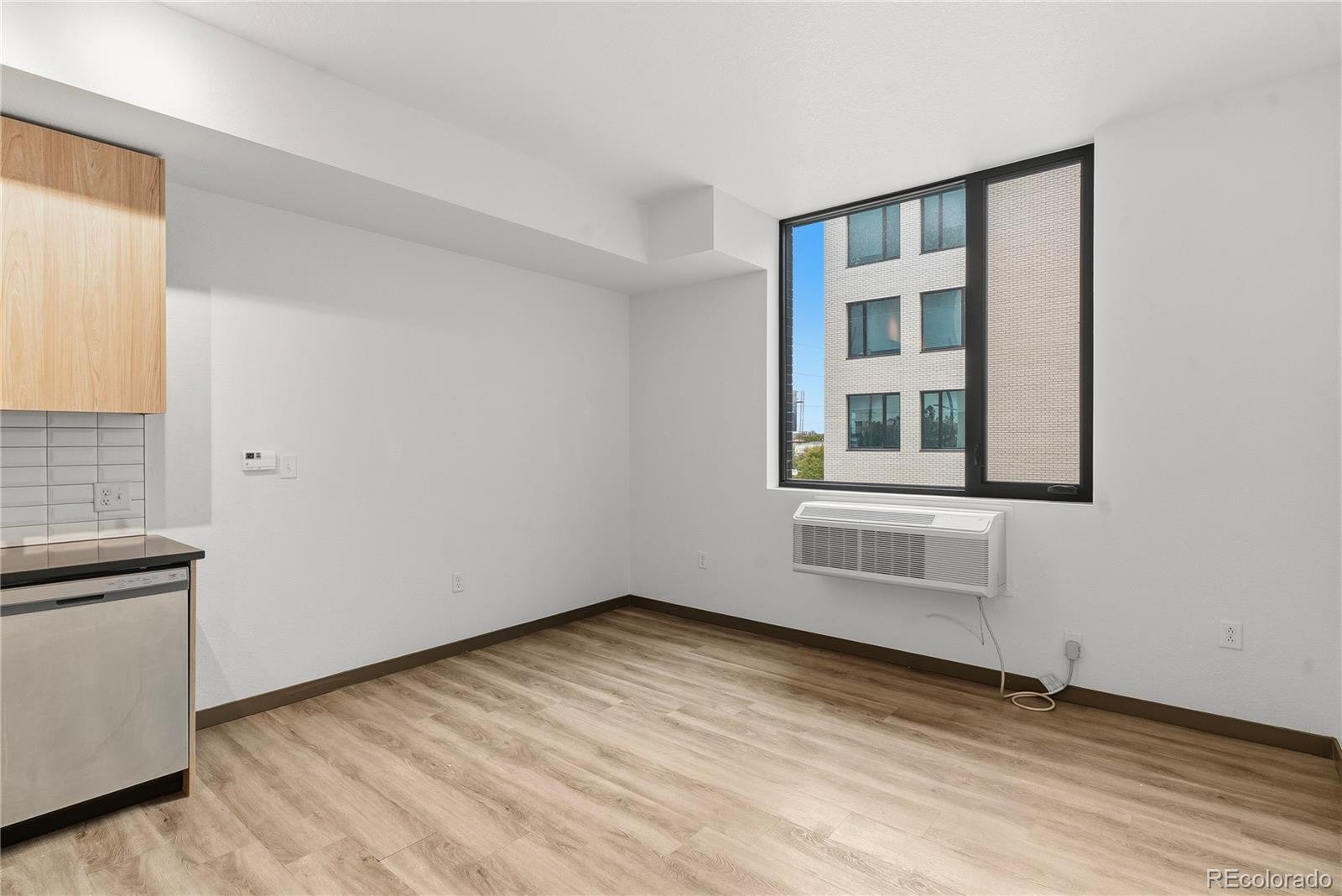 603 Inca Street, Unit 330 Denver, CO 80204 - Photo 13 of 18 an empty room with windows