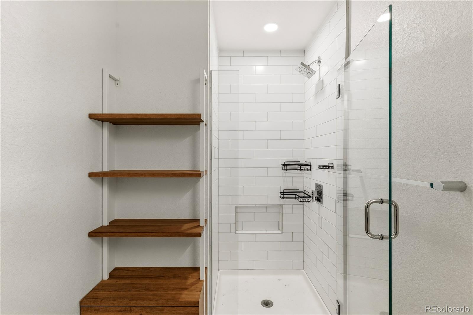 603 Inca Street, Unit 330 Denver, CO 80204 - Photo 17 of 18 a bathroom with a shower