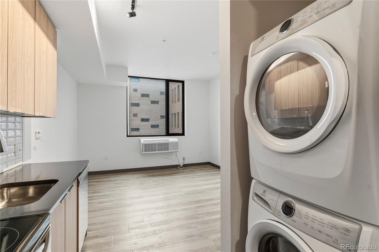 603 Inca Street, Unit 330 Denver, CO 80204 - Photo 8 of 18 a view of a kitchen with washer and dryer