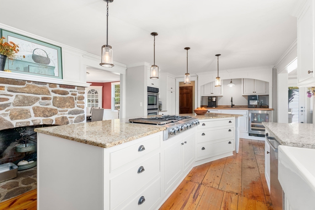 50 Tower Hill Road Brimfield, MA 01010 - Photo 11 of 40 a kitchen with stainless steel appliances kitchen island granite countertop a sink a counter space and cabinets