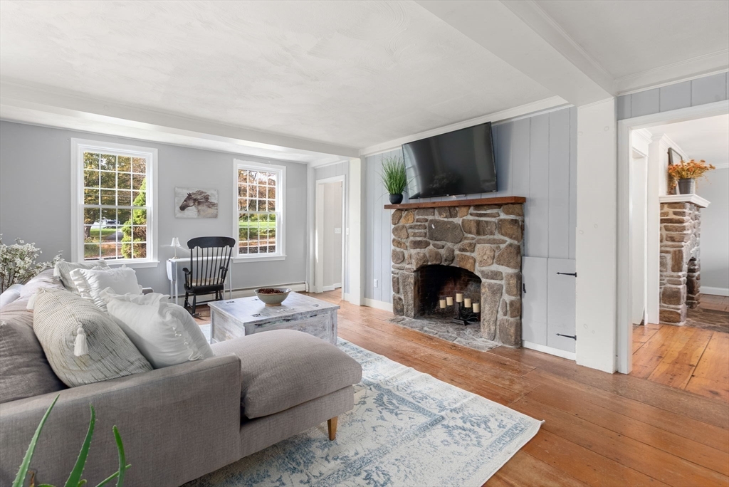 50 Tower Hill Road Brimfield, MA 01010 - Photo 20 of 40 a living room with furniture a flat screen tv and a fireplace