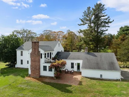 a view of house with yard and entertaining space