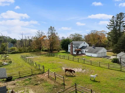 a view of a swimming pool with a yard