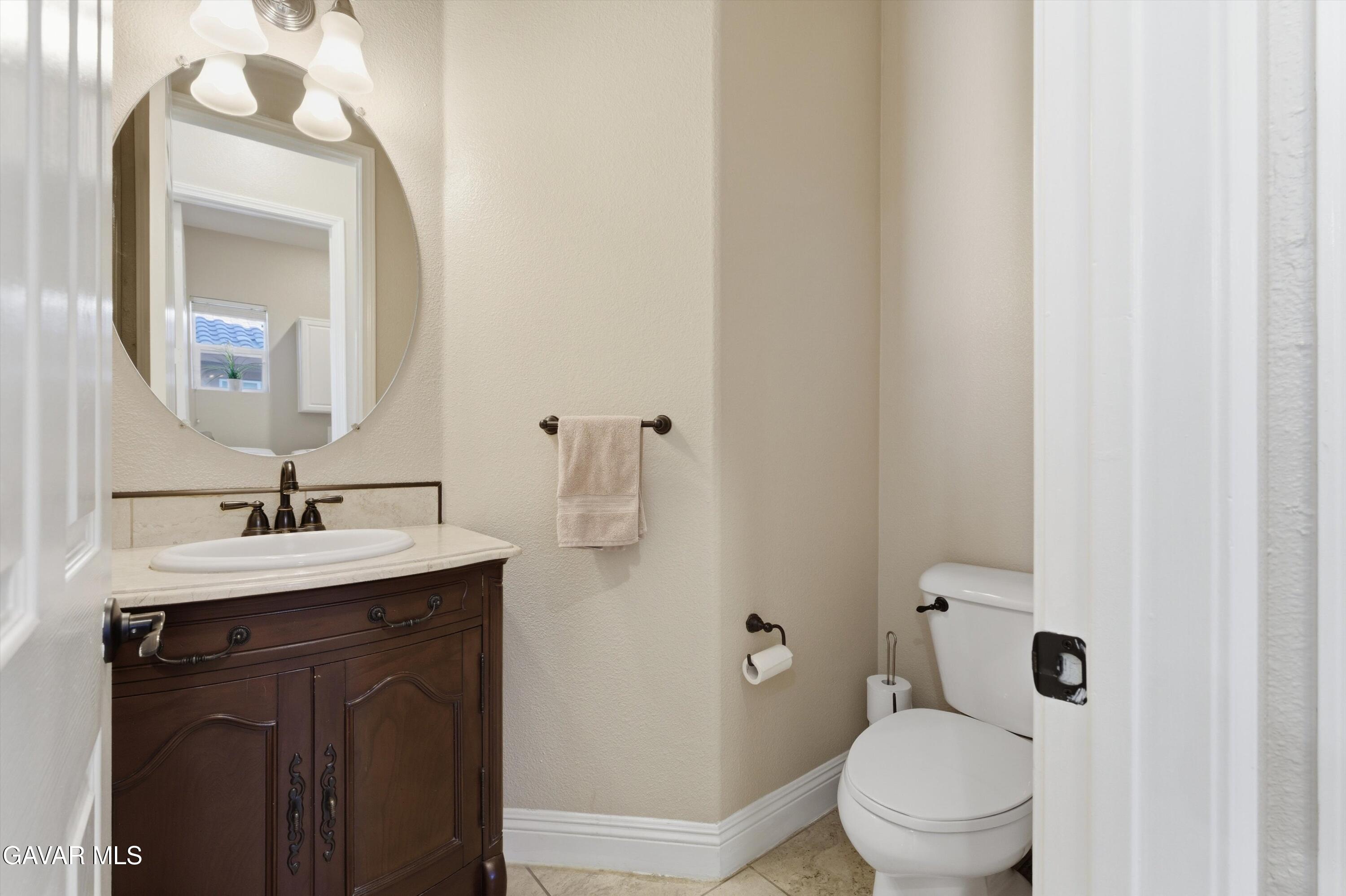 109 Oak Place Tehachapi, CA 93561 - Photo 1 of 25 a bathroom with a toilet a sink and mirror