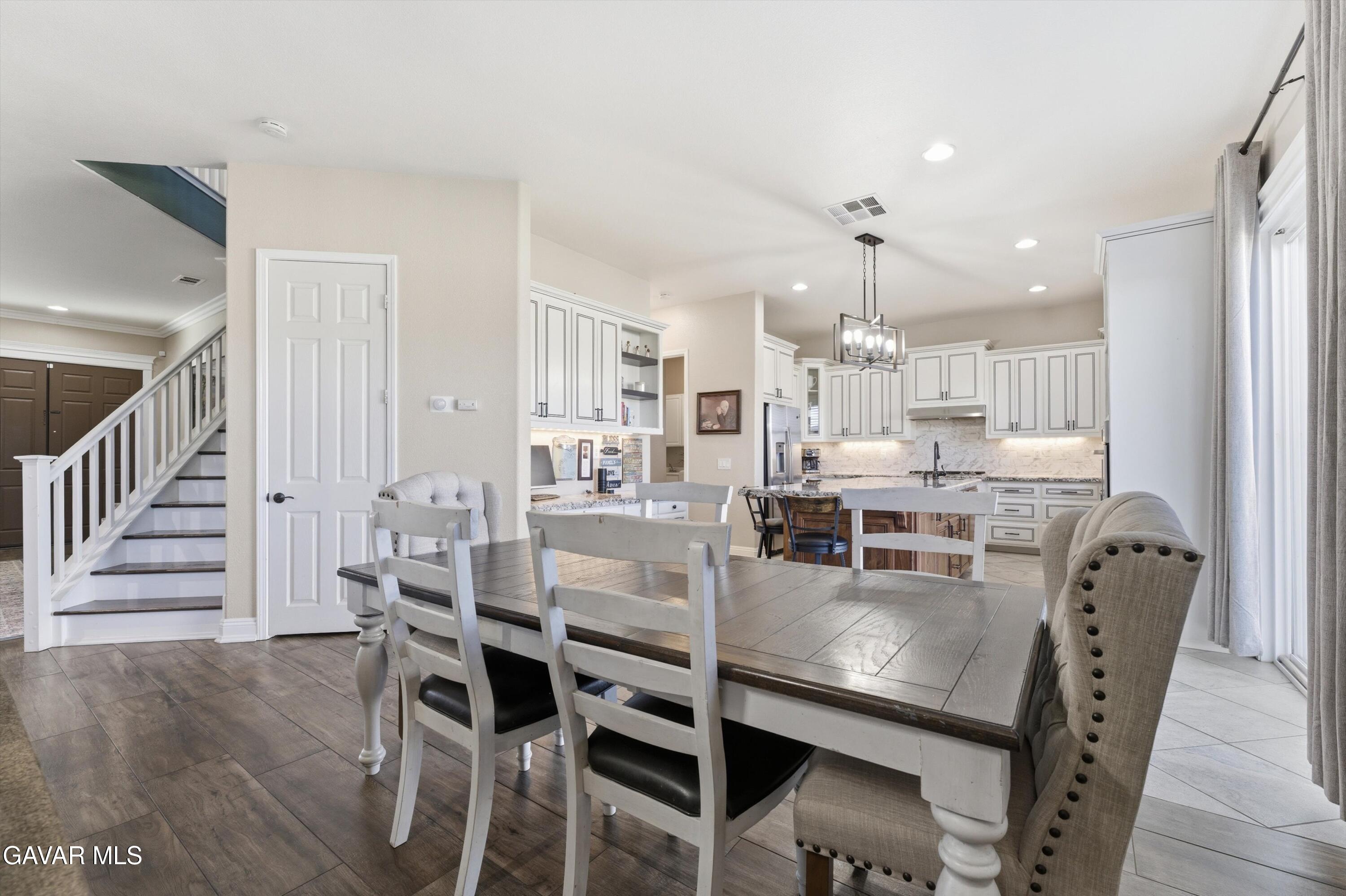 109 Oak Place Tehachapi, CA 93561 - Photo 9 of 25 a dining room with furniture and wooden floor