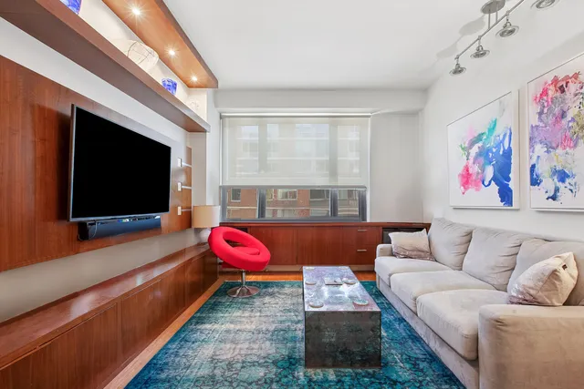 a view of room with window and wooden floor