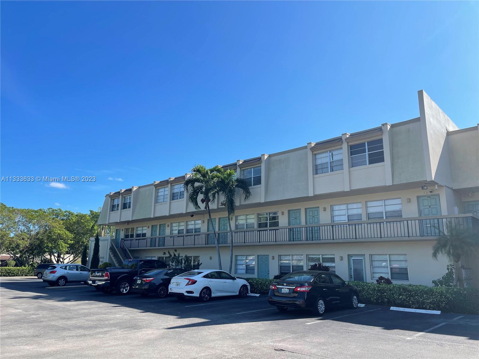 9500 Southwest 3rd Street, Unit C258 Boca Raton, FL 33428 - Photo 1 of 13 a car parked in front of a building