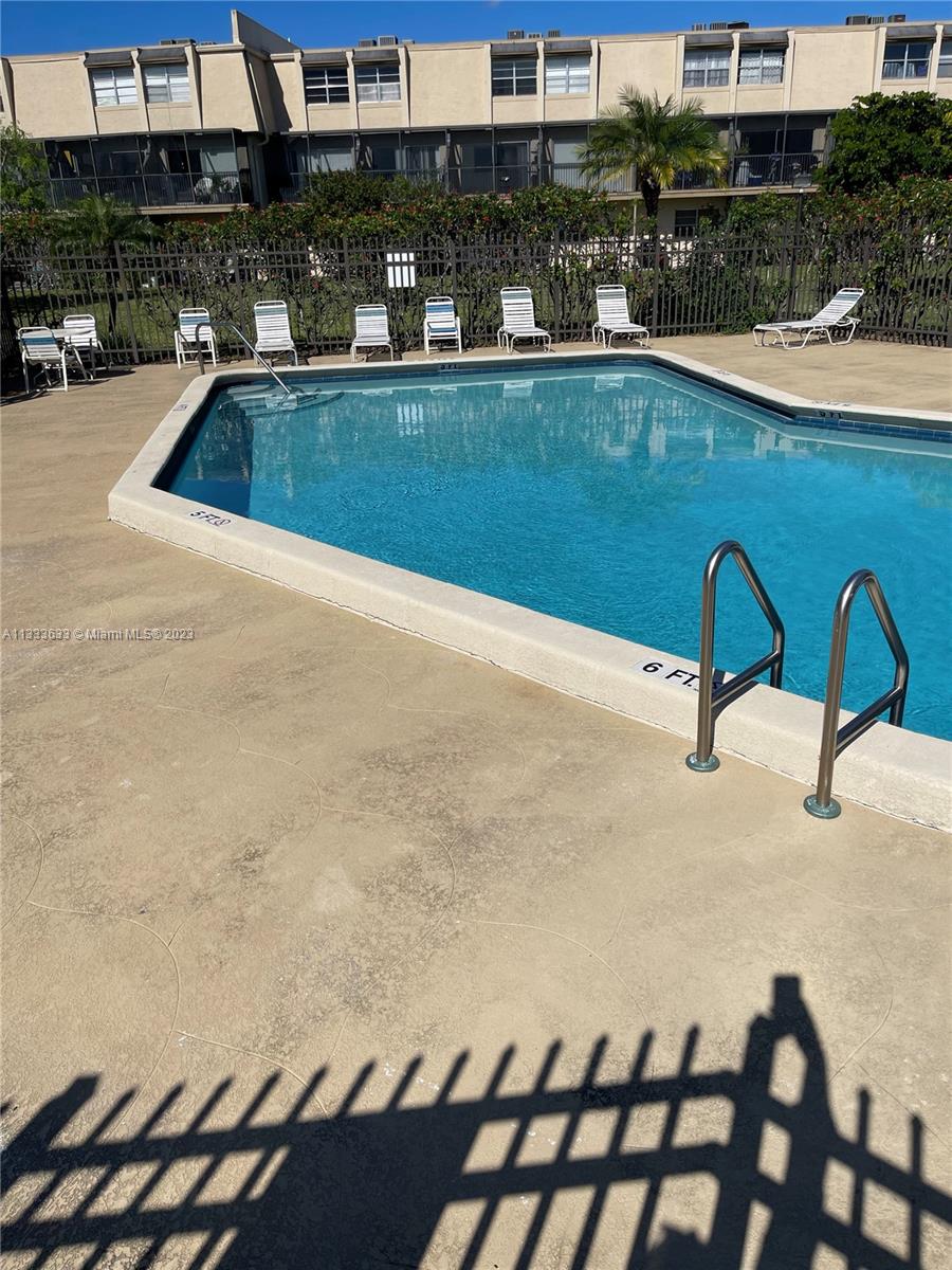 9500 Southwest 3rd Street, Unit C258 Boca Raton, FL 33428 - Photo 12 of 13 a view of swimming pool outdoor seating