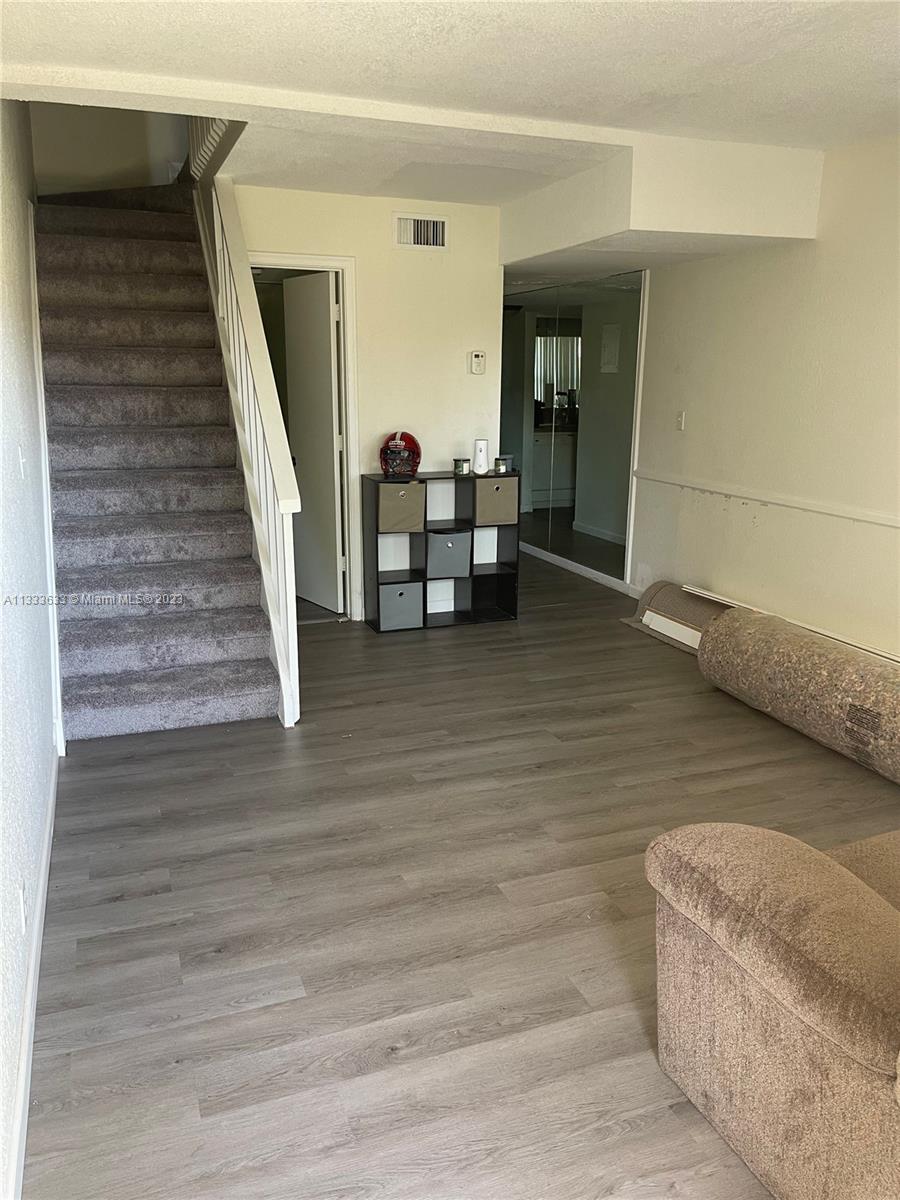 9500 Southwest 3rd Street, Unit C258 Boca Raton, FL 33428 - Photo 2 of 13 a view of livingroom with furniture and stairs