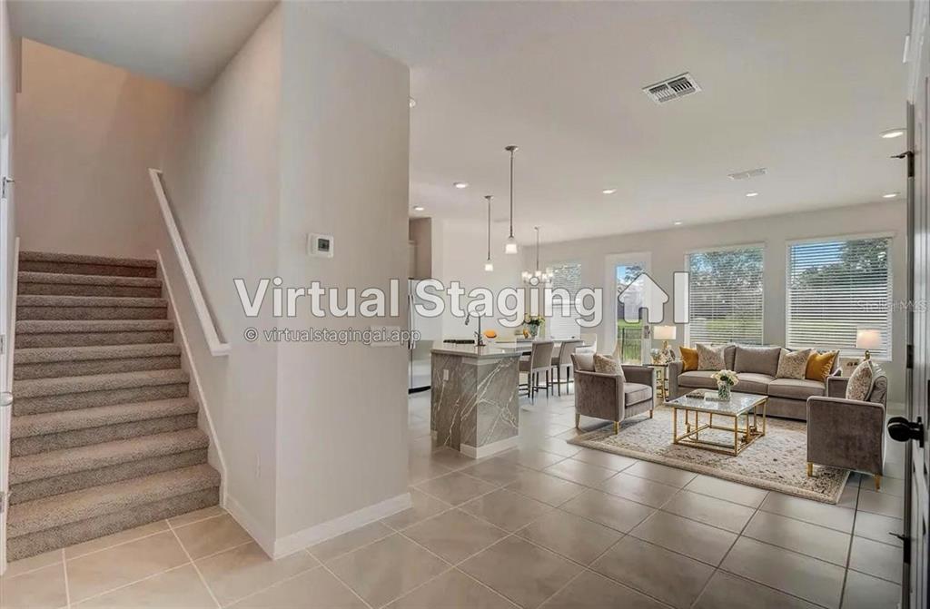 a room with lots of white furniture and window