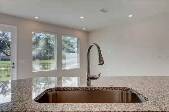 a kitchen with a sink and a window