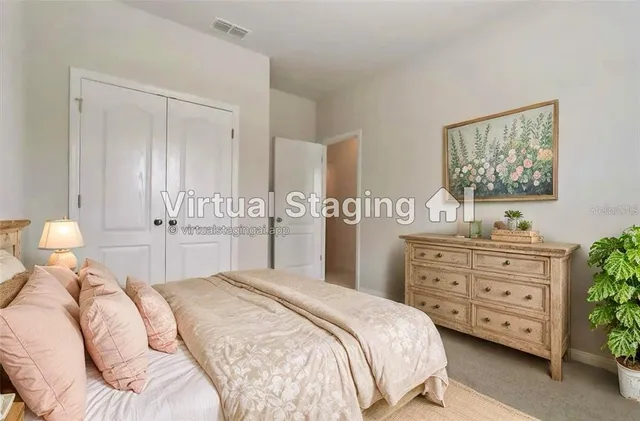 a bedroom with a bed and a dresser