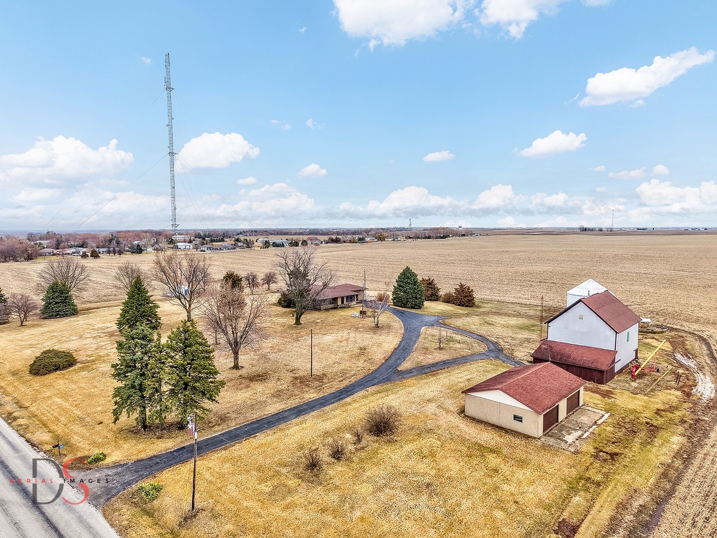 a view of a terrace with lawn chairs