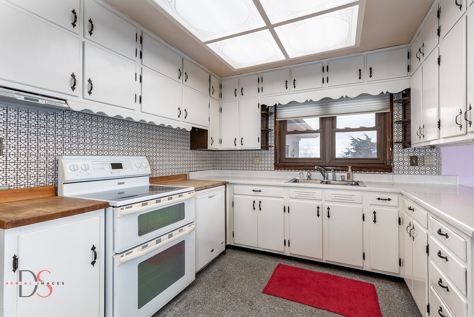 3476 East 27th Road Marseilles, IL 61341 - Photo 12 of 32 a kitchen with stainless steel appliances white cabinets and a sink