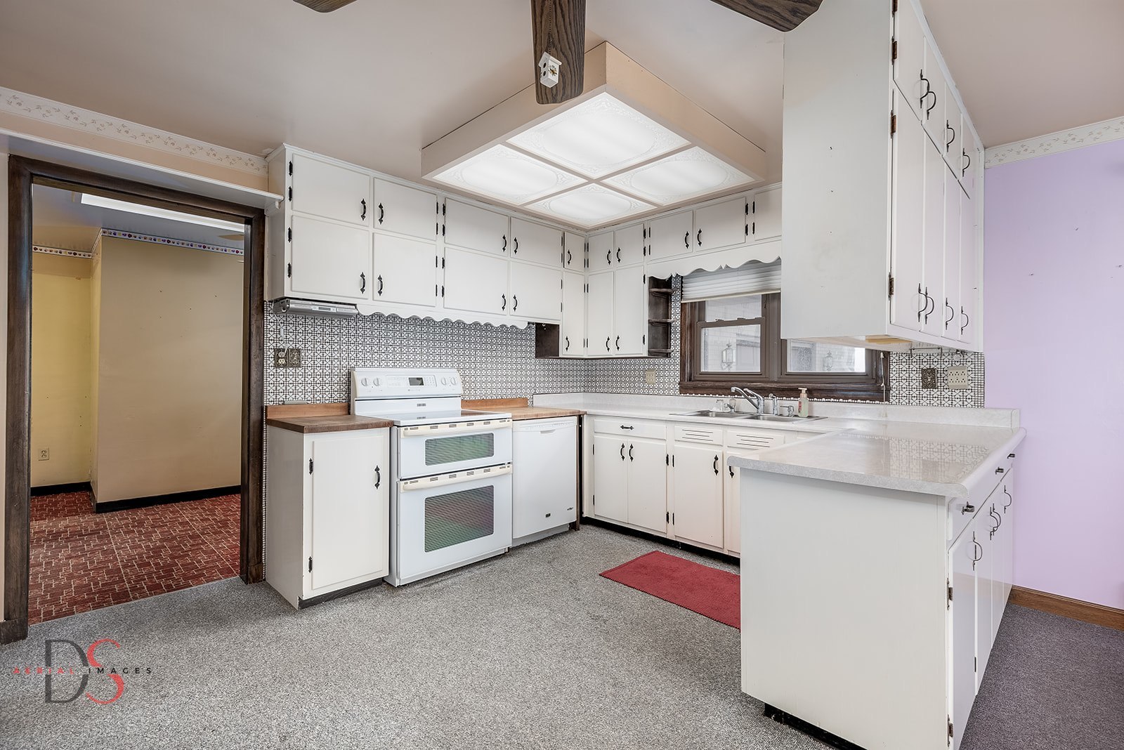 3476 East 27th Road Marseilles, IL 61341 - Photo 13 of 32 a kitchen with granite countertop white cabinets and white appliances