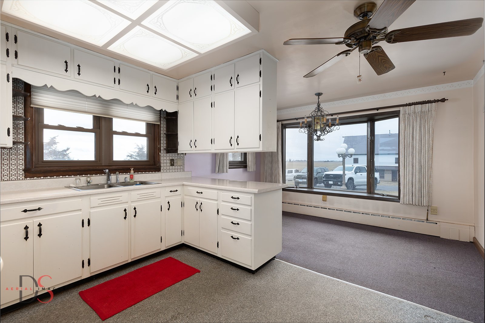 3476 East 27th Road Marseilles, IL 61341 - Photo 15 of 32 a kitchen with granite countertop white cabinets white appliances a sink and a large window