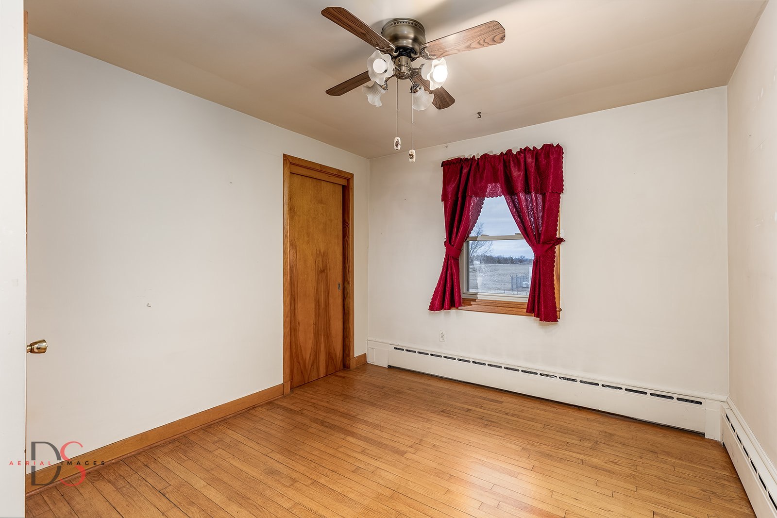 3476 East 27th Road Marseilles, IL 61341 - Photo 21 of 32 a view of an empty room with window and a ceiling fan