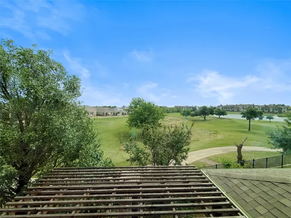 a view of a lake with a yard
