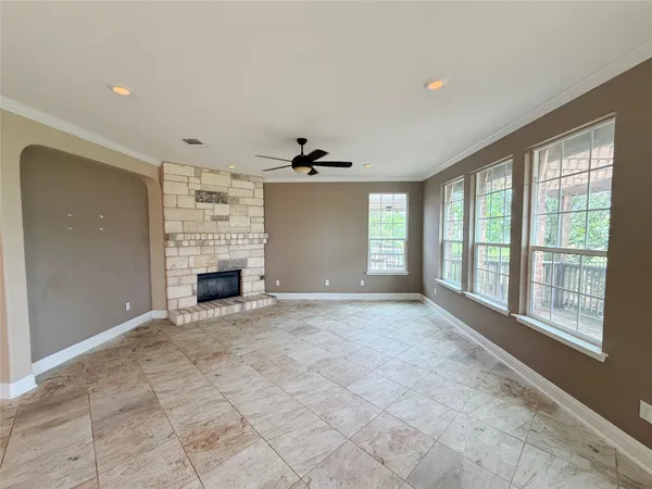 a kitchen with stainless steel appliances kitchen island granite countertop a sink stove and cabinets