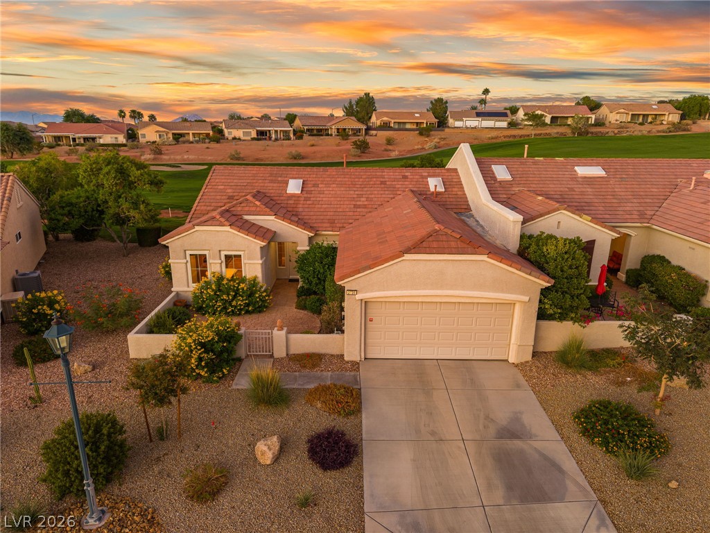 2738 Grand Forks Road Henderson, NV 89052 - Photo 1 of 52 Desert landscaping and a tiled roof complement this classic single-story home bordering a golf course.