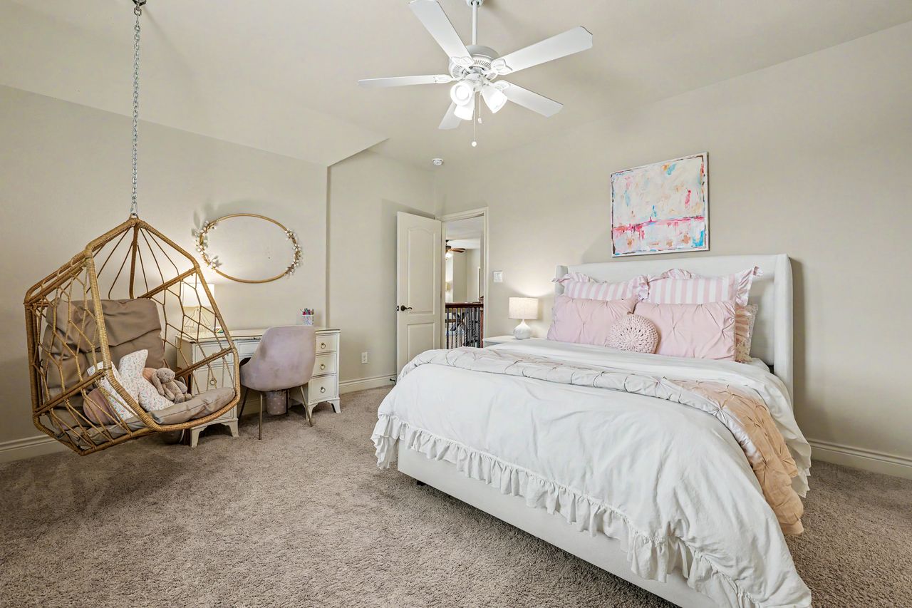 809 Prairie Dunes Drive Georgetown, TX 78628 - Photo 29 of 40 Plush carpet and a gentle ceiling fan create a serene and restful atmosphere for a private retreat.