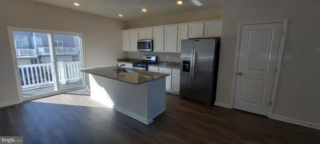 a view of workspace with wooden floor