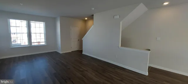 a bathroom with a toilet a sink and a window