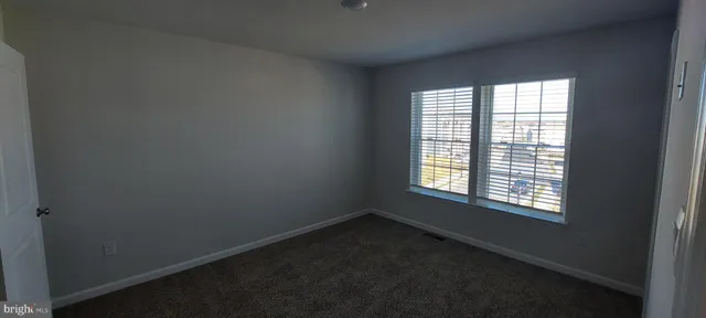 an empty room with closet area