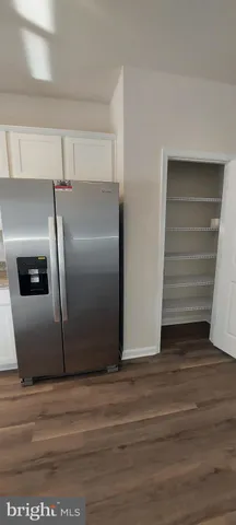 a stove top oven sitting inside of a kitchen