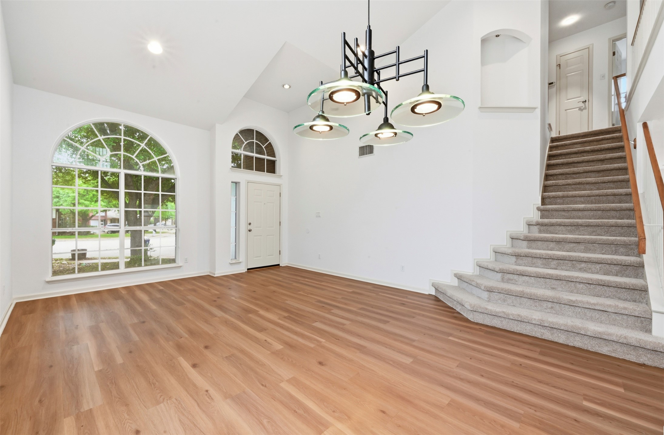 3629 Ruby Red Drive Austin, TX 78728 - Photo 5 of 34 Dining area featuring lofted ceiling, light wood-style floors, and suspended lighting