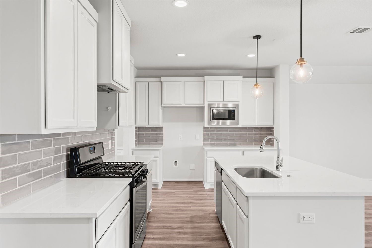 2125 Rope Maker Road Conroe, TX 77384 - Photo 12 of 45 Chef's kitchen with large kitchen island and stainless steel appliances.