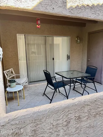 a outdoor space with a couch and chairs