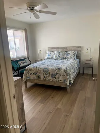 a bedroom with a bed and window