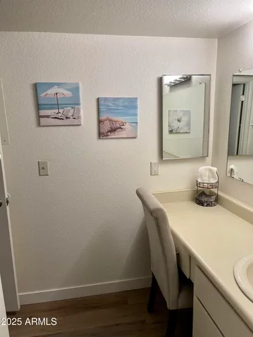 a room with a table and a painting