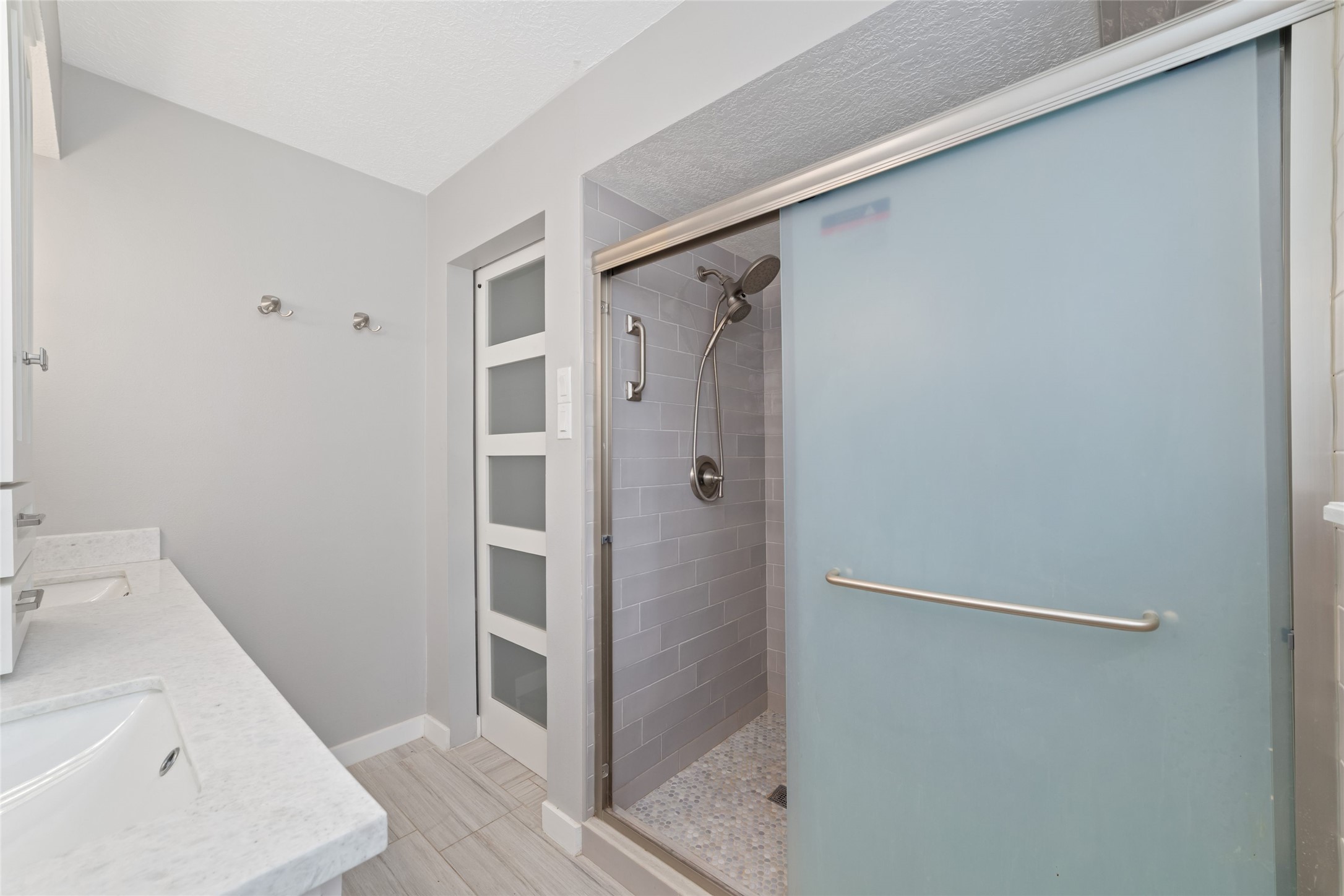 7910 Oak Moss Drive Spring, TX 77379 - Photo 17 of 38 Sliding glass door shower with new shower head and backsplash.