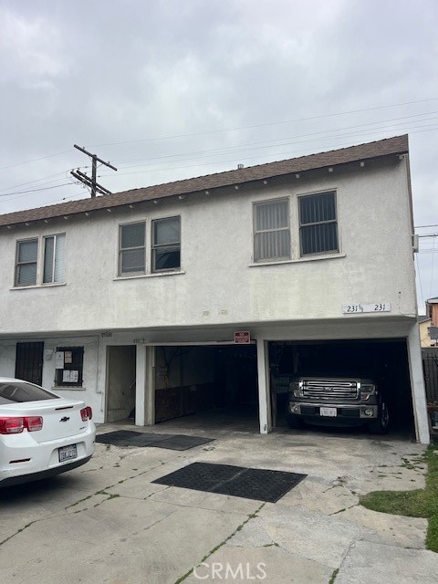 231 West 88th Street Los Angeles, CA 90003 - Photo 13 of 15 a car parked in front of a building