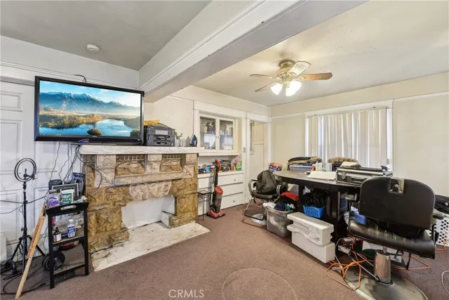 a room with furniture and a flat screen tv