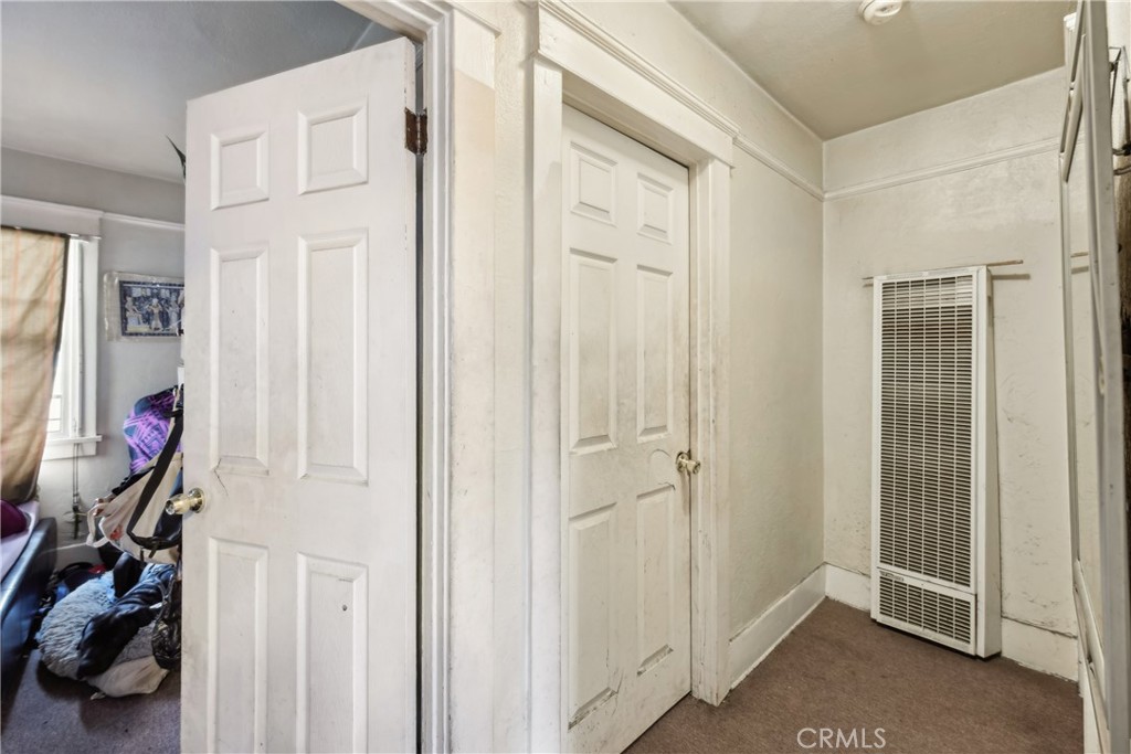 231 West 88th Street Los Angeles, CA 90003 - Photo 8 of 15 a view of an entryway with wooden floor